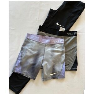 Nike girls bundle in size XL, 1 pair of leggings and 2 pairs of spandex.